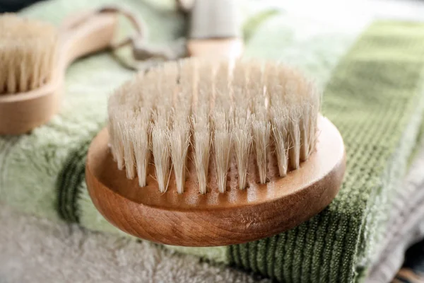 Massage brush on towel, closeup — Stock Photo, Image