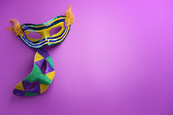 Festive masks on color background — Stock Photo, Image