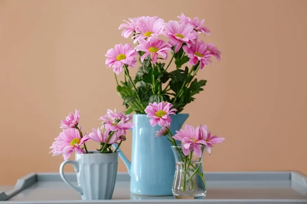 Vases with beautiful flowers on table — Stock Photo, Image