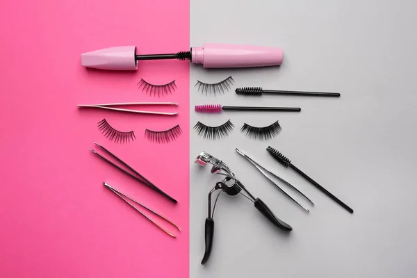 Mascara with false eyelashes and tools on color background — Stock Photo, Image