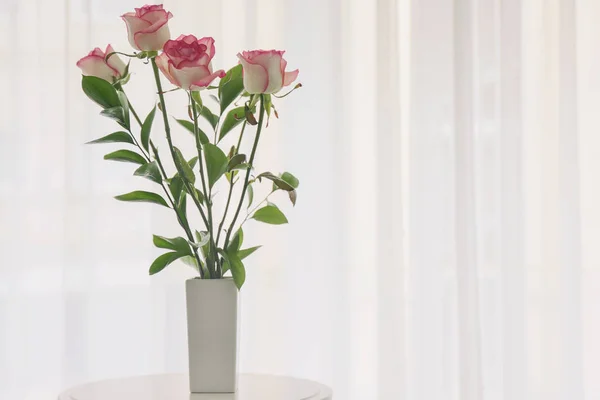 Vase with beautiful flowers in room — Stock Photo, Image