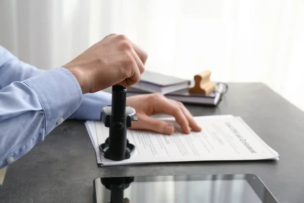 Notary public stamping document in office — Stock Photo, Image