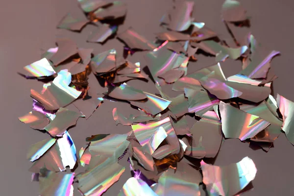 Torn pieces of foil on table — Stock Photo, Image