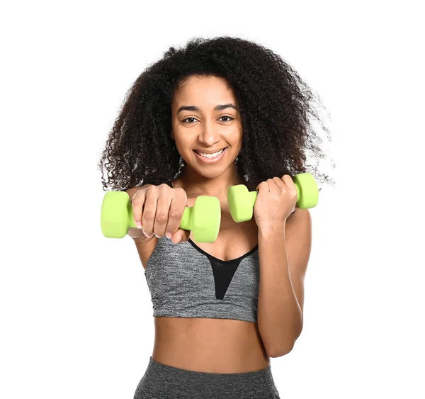 Sporty African-American woman with dumbbells on white background — Stock Photo, Image