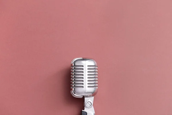 Retro microphone on color background — Stock Photo, Image