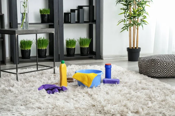Cleaning supplies on soft carpet in room — Stock Photo, Image