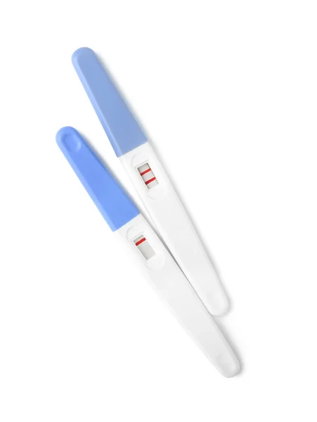 Negative and positive pregnancy tests on white background — Stock Photo, Image