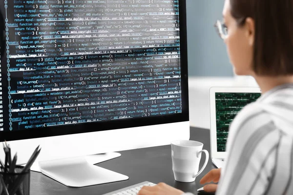 Female programmer working in office — Stock Photo, Image