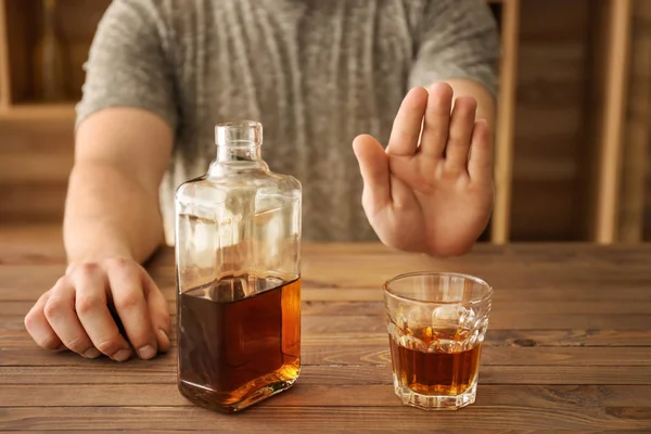 Man refusing to drink whisky in bar — Stock Photo, Image