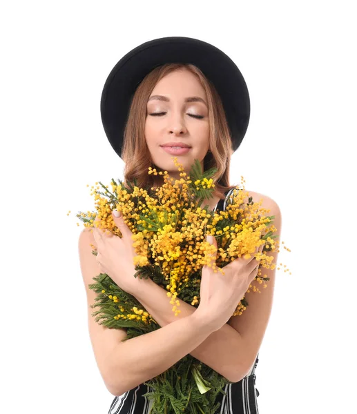 Beautiful young woman with bouquet of mimosa flowers on white background — Stock Photo, Image