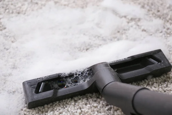Washing of carpet with vacuum cleaner