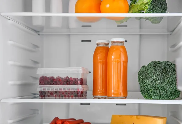 Open fridge full of different food