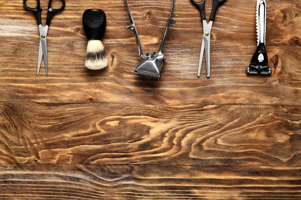 Set of male shaving accessories with hair trimmer on wooden background — Stock Photo, Image