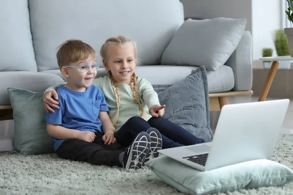 Cute little children watching cartoons at home — Stock Photo, Image