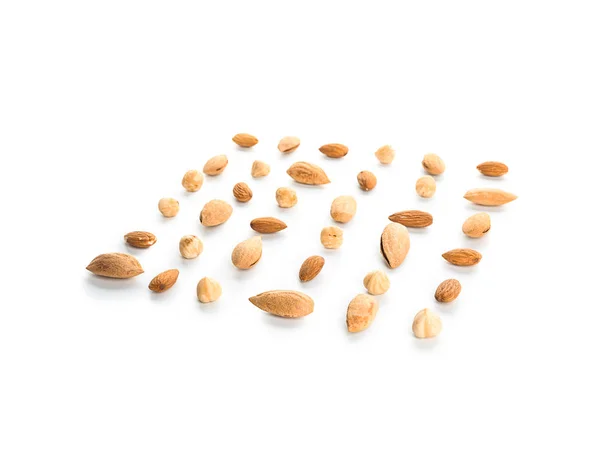 Different tasty nuts on white background — Stock Photo, Image