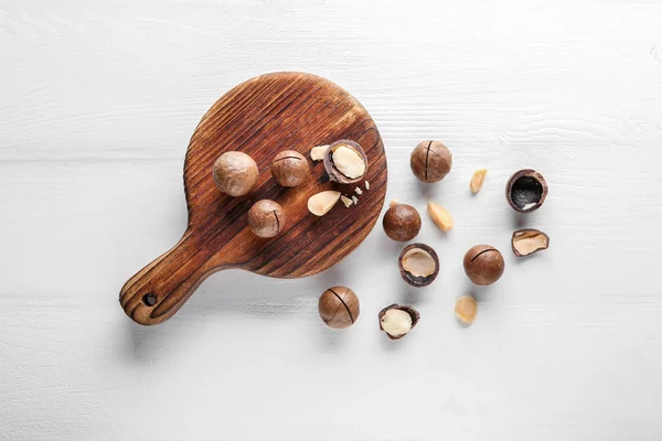 Tasty macadamia nuts on white table — Stock Photo, Image