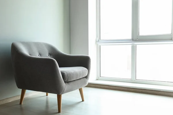 Comfortable armchair near window — Stock Photo, Image