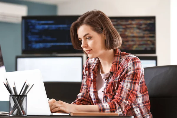 Female programmer working in office — Stock Photo, Image