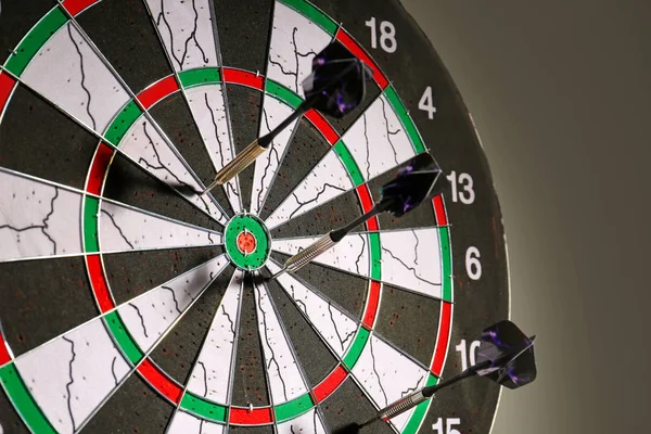 Dartboard on dark background, closeup