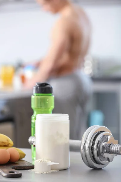 Ingredients for protein shake and dumbbell on table — Stock Photo, Image