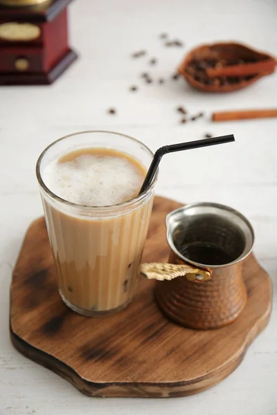 Glass of tasty frappe coffee on white table — Stock Photo, Image