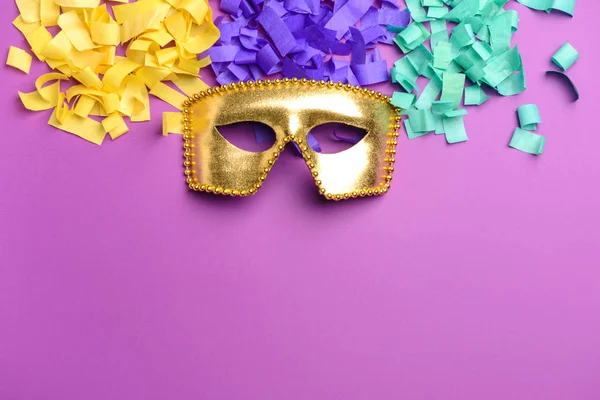 Festive mask with confetti on color background — Stock Photo, Image