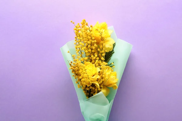 Bouquet with beautiful mimosa flowers on color background