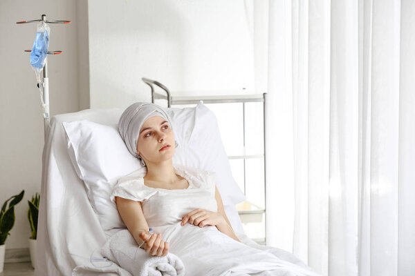 Young woman undergoing chemical therapy course in clinic