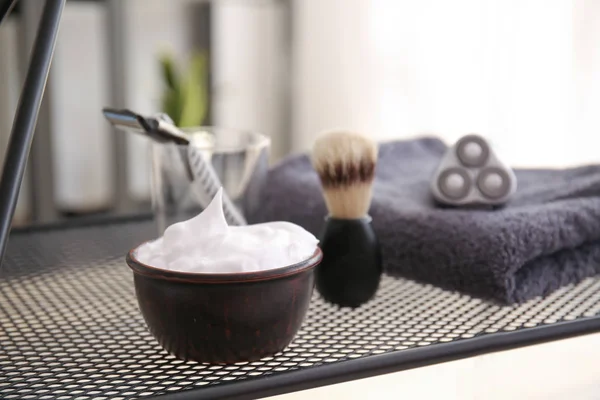 Shaving foam with accessories on table — Stock Photo, Image