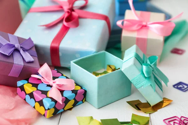 Different gift boxes on white table — Stock Photo, Image