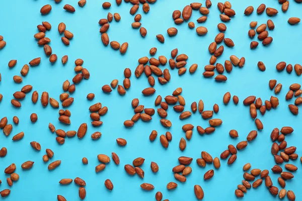 Tasty peanuts on color background — Stock Photo, Image