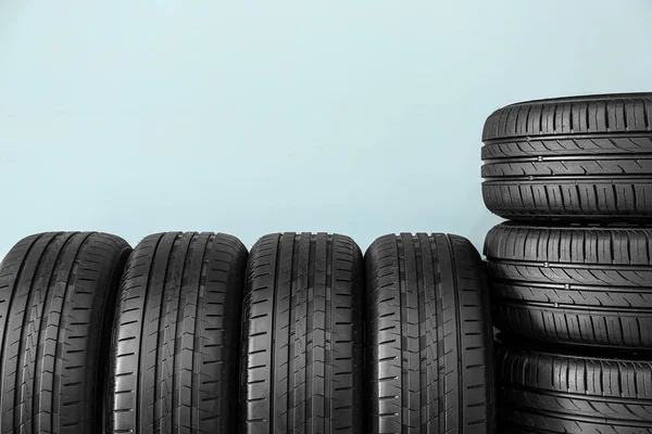 Car tires on color background — Stock Photo, Image
