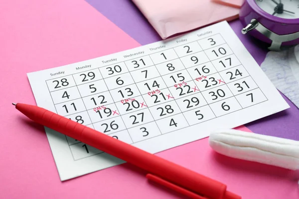 Menstrual calendar on color background — Stock Photo, Image