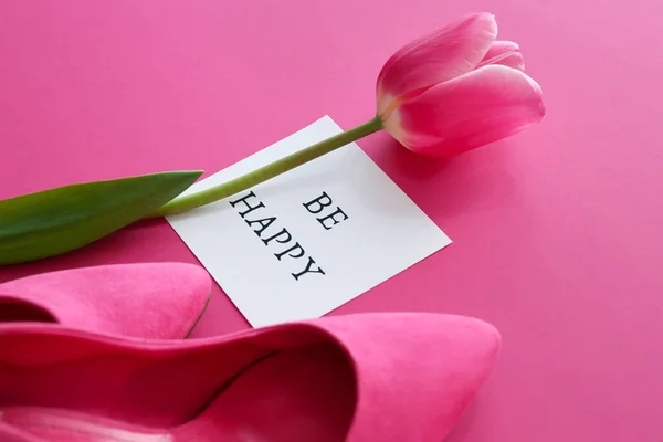 Beautiful tulip flower, female shoes and card with text BE HAPPY on color background — Stock Photo, Image