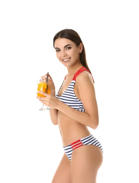 Beautiful young woman in swimming suit and with cocktail on white background — Stock Photo, Image