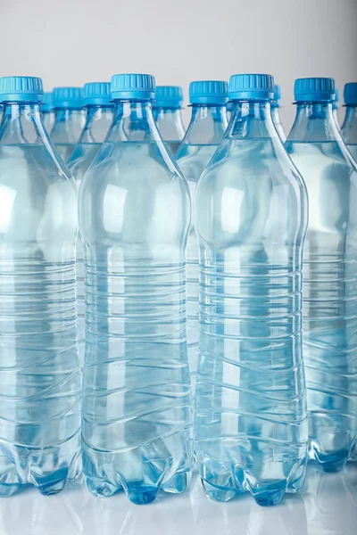 Bottles of water on light background — Stock Photo, Image