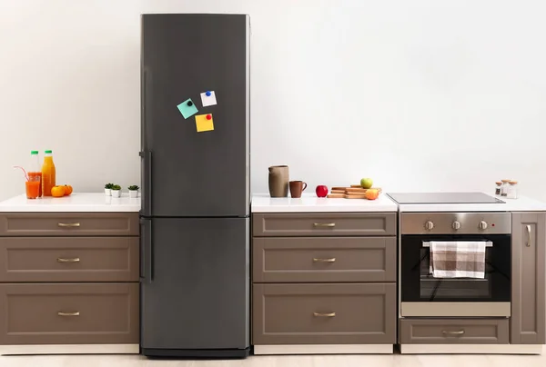 Big modern fridge in interior of kitchen