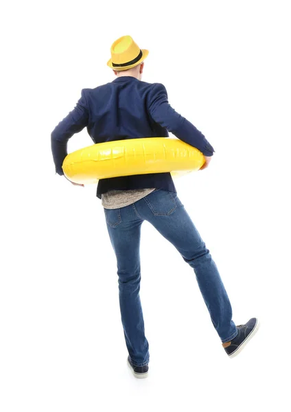 Funny young tourist with inflatable ring on white background, back view — Stock Photo, Image