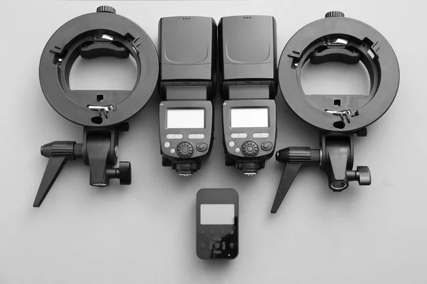 Modern equipment of professional photographer on grey background — Stock Photo, Image