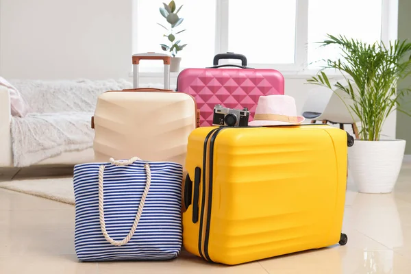Packed suitcases and beach bag in room. Travel concept — Stock Photo, Image