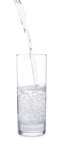 Pouring of water into glass on white background — Stock Photo, Image