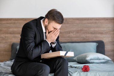 Man pining after his relative after funeral clipart