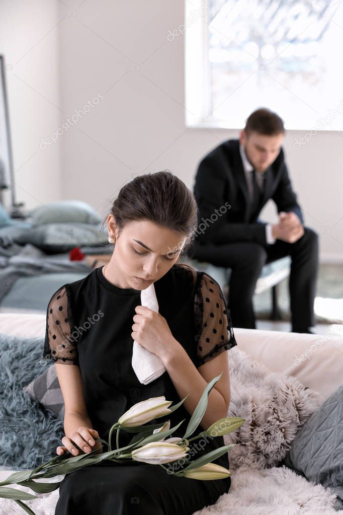 Woman pining after her relative at funeral