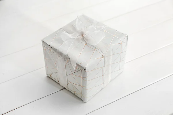 Gift box on white table — Stock Photo, Image