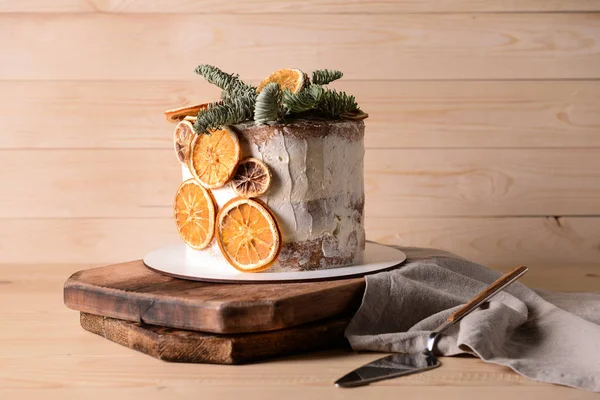 Sweet Christmas cake on wooden table — Stock Photo, Image