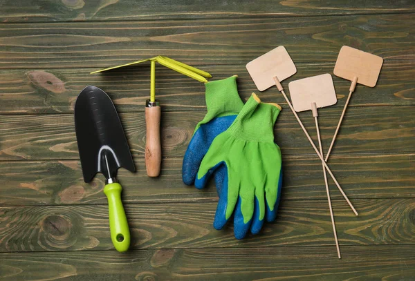 Composition with gardening tools on wooden background — Stock Photo, Image