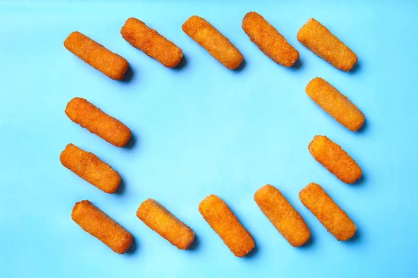 Frame made of tasty mozzarella sticks on color background — Stock Photo, Image