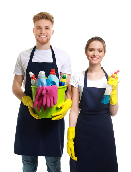 Team of janitors with cleaning supplies on white background — Stock Photo, Image