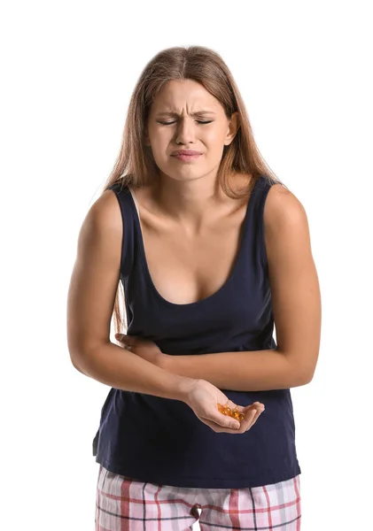 Pregnant woman with vitamins suffering from toxicosis on white background — Stock Photo, Image