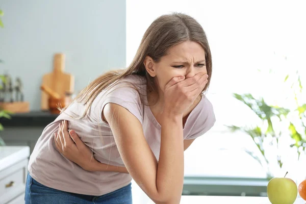 Pregnant woman suffering from toxicosis at home — Stock Photo, Image